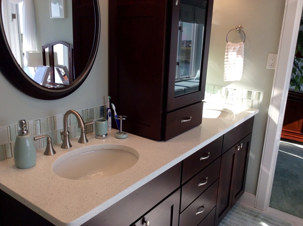 This is an example of a large beach style ensuite bathroom in Philadelphia with shaker cabinets, dark wood cabinets, a corner shower, a two-piece toilet, green tiles, porcelain tiles, white walls, marble flooring, an integrated sink, engineered stone worktops, white floors and a hinged door.