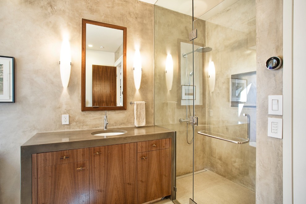 Photo of a small modern bathroom in San Francisco with a hinged door, flat-panel cabinets, dark wood cabinets, beige tiles, brown tiles and marble worktops.