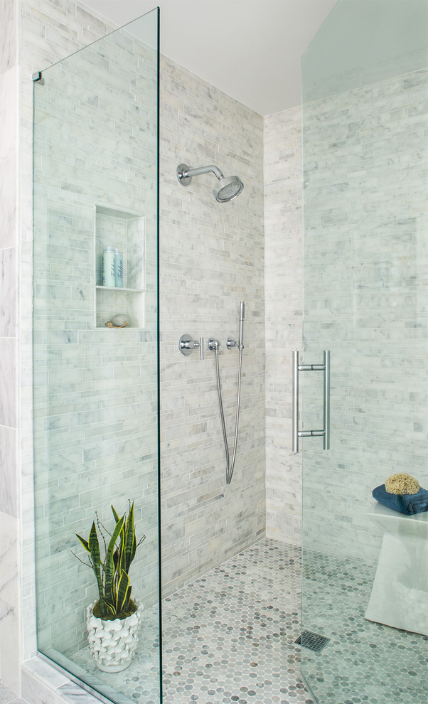 Inspiration for a large traditional ensuite bathroom in Atlanta with a submerged sink, shaker cabinets, white cabinets, marble worktops, a freestanding bath, an alcove shower, a one-piece toilet, grey tiles, stone tiles and beige walls.