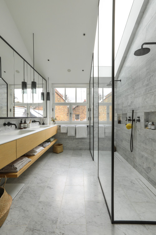 Contemporary Splendor: Bathroom Storage with Marble Tiles and Skylight