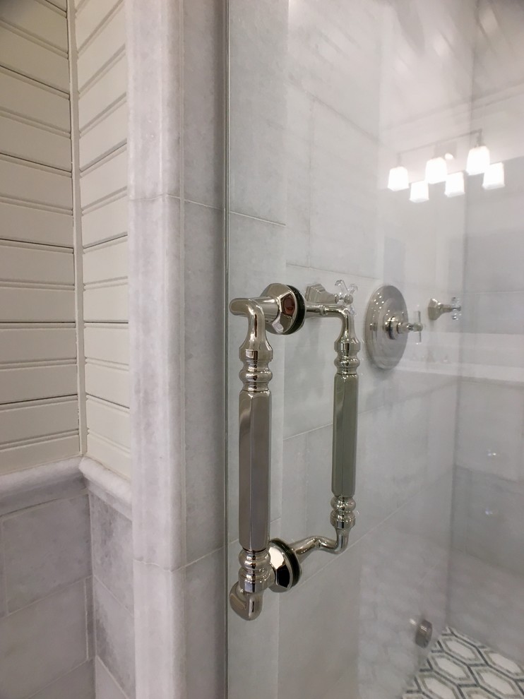 Inspiration for a mid-sized timeless master multicolored tile and marble tile marble floor alcove shower remodel in Milwaukee with flat-panel cabinets, white cabinets, a one-piece toilet, white walls, an undermount sink and quartzite countertops