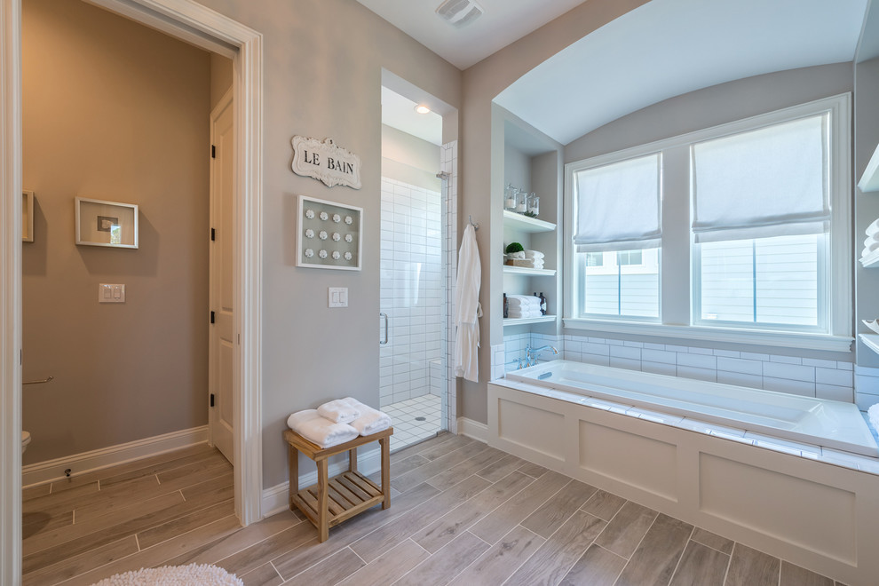 Inspiration for a transitional bathroom remodel in Jacksonville with a hinged shower door
