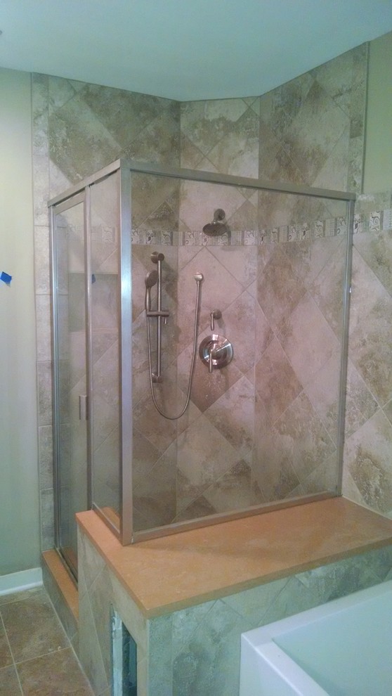 Photo of a medium sized contemporary bathroom in Houston with a corner bath, a corner shower, beige tiles and porcelain tiles.