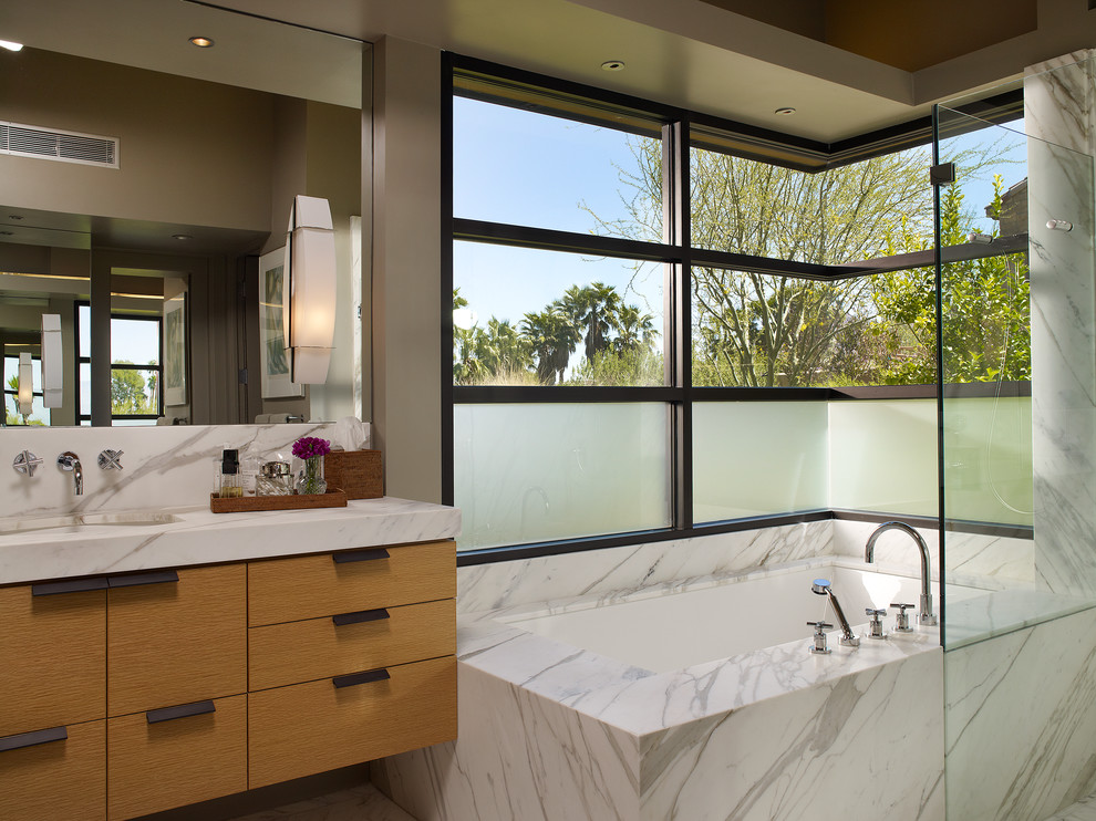Bathroom - contemporary white tile bathroom idea in Los Angeles with an undermount sink, flat-panel cabinets, medium tone wood cabinets and an undermount tub