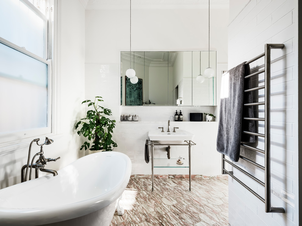 Inspiration for a medium sized bohemian ensuite bathroom in Sydney with open cabinets, white cabinets, a claw-foot bath, an alcove shower, a one-piece toilet, white tiles, ceramic tiles, white walls, marble flooring, a console sink, marble worktops, multi-coloured floors, a hinged door and white worktops.