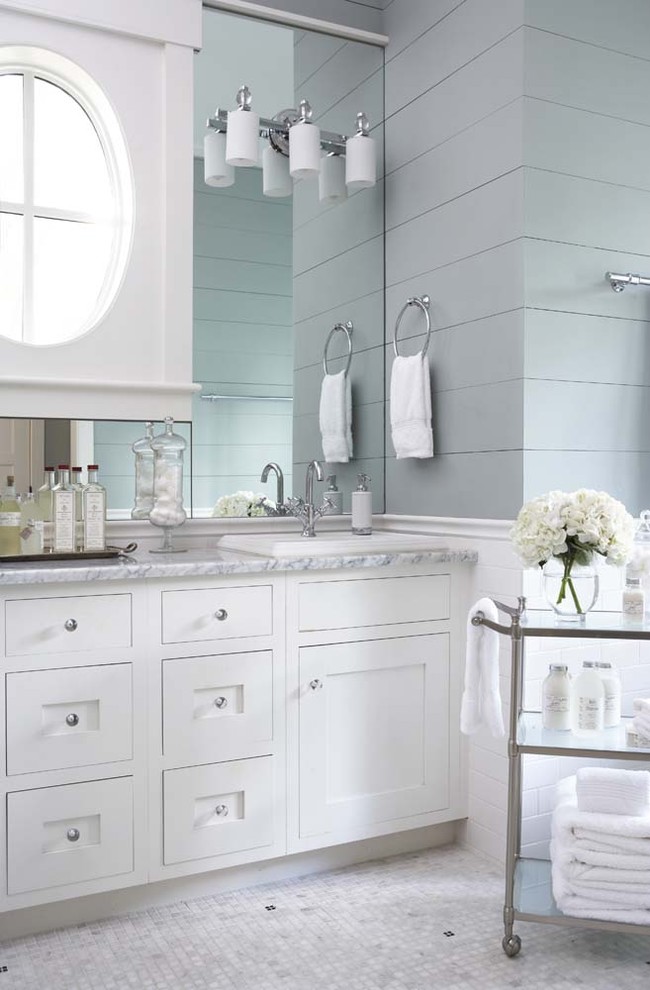 Inspiration for a large timeless master white tile and subway tile mosaic tile floor bathroom remodel in Charleston with shaker cabinets, white cabinets, marble countertops, blue walls and a drop-in sink