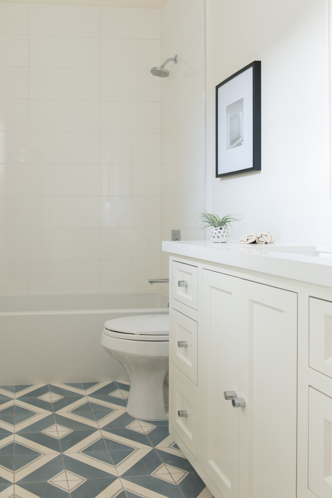 Mid-sized transitional blue tile and cement tile light wood floor bathroom photo in San Francisco with an undermount sink, shaker cabinets, white cabinets, quartz countertops, a one-piece toilet and white walls