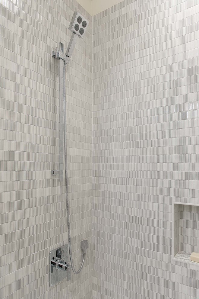 Example of a mid-sized transitional white tile and ceramic tile porcelain tile doorless shower design in San Francisco with an undermount sink, shaker cabinets, white cabinets, quartz countertops, a one-piece toilet and white walls