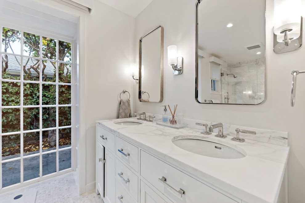 Mid-sized trendy 3/4 white tile and subway tile porcelain tile and multicolored floor corner shower photo in San Francisco with flat-panel cabinets, white cabinets, a two-piece toilet, gray walls, an undermount sink, marble countertops, a hinged shower door and white countertops