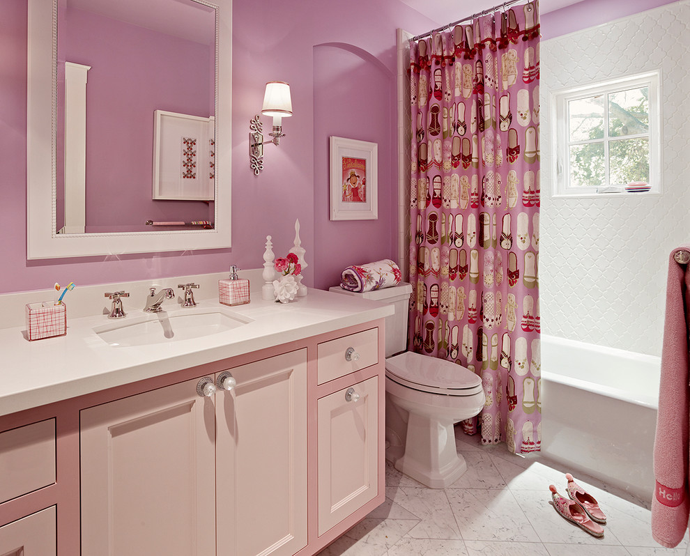 Transitional kids' white tile bathroom photo in San Francisco with an undermount sink, recessed-panel cabinets, a two-piece toilet and pink cabinets