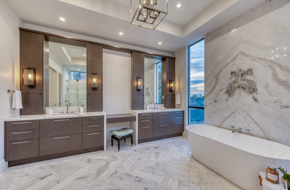 Huge trendy master gray tile and stone slab marble floor, double-sink and tray ceiling bathroom photo with flat-panel cabinets, gray cabinets, white walls, an undermount sink, quartzite countertops, a hinged shower door, white countertops and a built-in vanity