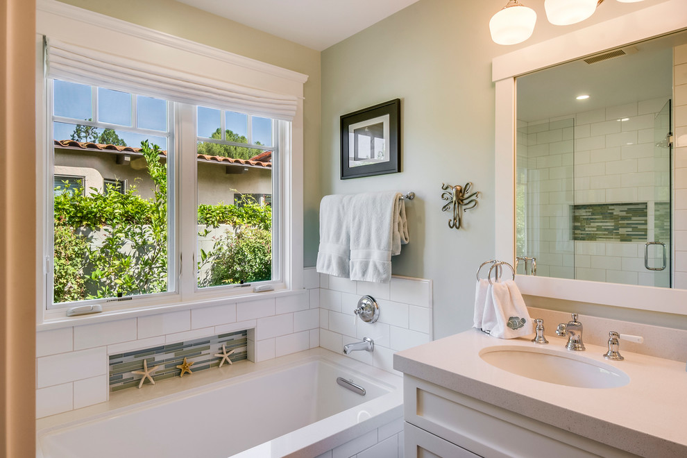 Example of a mid-sized transitional kids' white tile and ceramic tile ceramic tile corner shower design in Los Angeles with shaker cabinets, white cabinets, quartz countertops, an undermount tub, an undermount sink and green walls