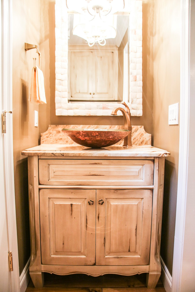 Inspiration for a small rustic 3/4 concrete floor and multicolored floor bathroom remodel in Miami with raised-panel cabinets, distressed cabinets, beige walls, a console sink, marble countertops and multicolored countertops