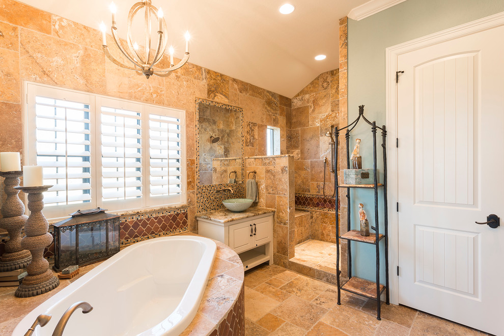 Inspiration for a mediterranean bathroom in Austin with a vessel sink, a built-in bath, a walk-in shower, an open shower and raised-panel cabinets.