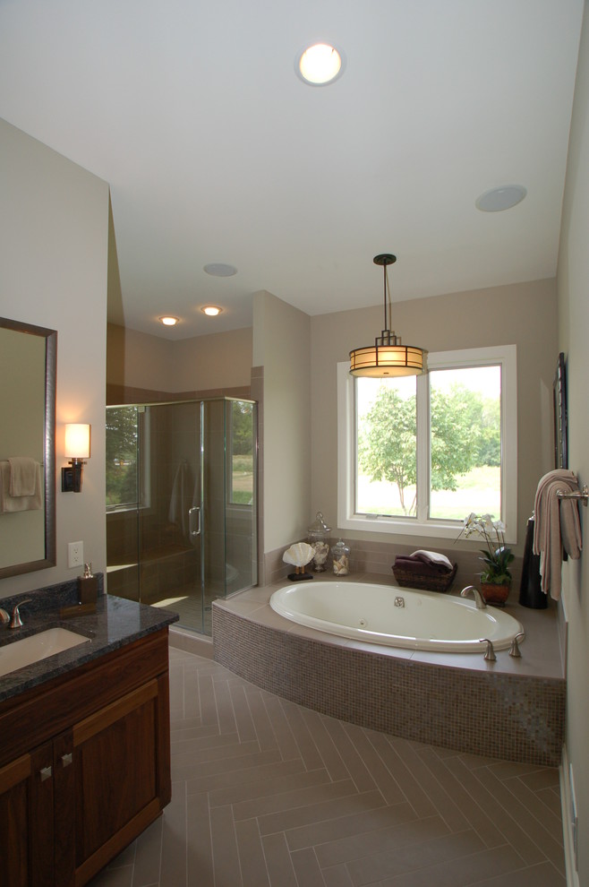 Example of a large trendy master beige tile and ceramic tile ceramic tile corner shower design in Milwaukee with an undermount sink, flat-panel cabinets, medium tone wood cabinets, quartzite countertops, a hot tub and beige walls