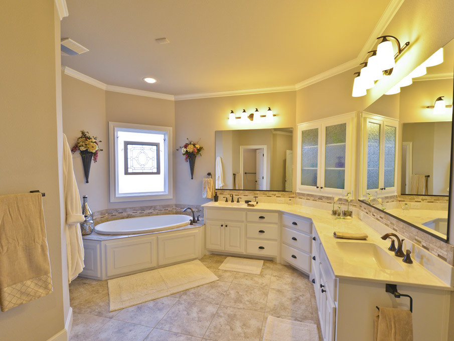 Example of a mid-sized classic master beige tile and stone tile travertine floor bathroom design in Austin with raised-panel cabinets, white cabinets, beige walls, an integrated sink and limestone countertops