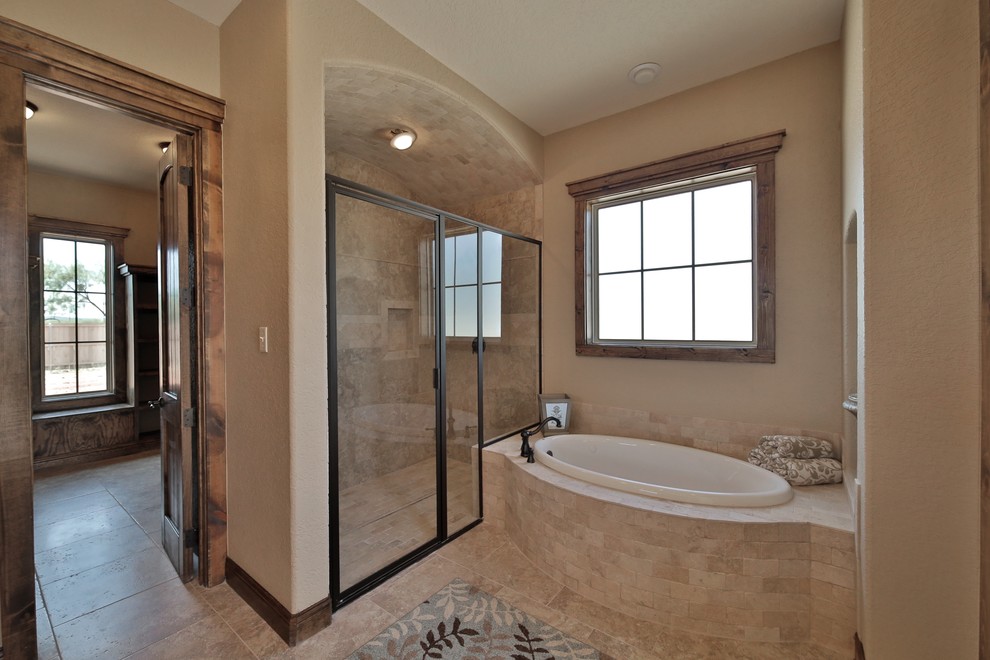Photo of a medium sized mediterranean ensuite bathroom in Dallas with a submerged sink, shaker cabinets, granite worktops, a built-in bath, an alcove shower, a two-piece toilet, beige tiles, stone tiles, beige walls and porcelain flooring.