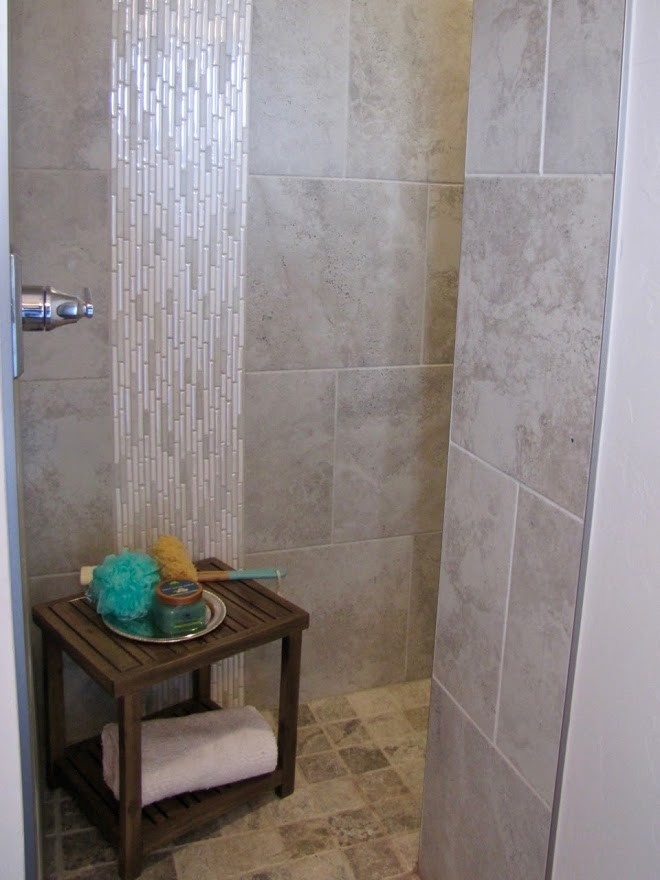 This is an example of a medium sized traditional ensuite bathroom in Oklahoma City with shaker cabinets, grey cabinets, an alcove bath, an alcove shower, a two-piece toilet, black tiles, white walls, porcelain flooring, a submerged sink, granite worktops, black floors and a shower curtain.