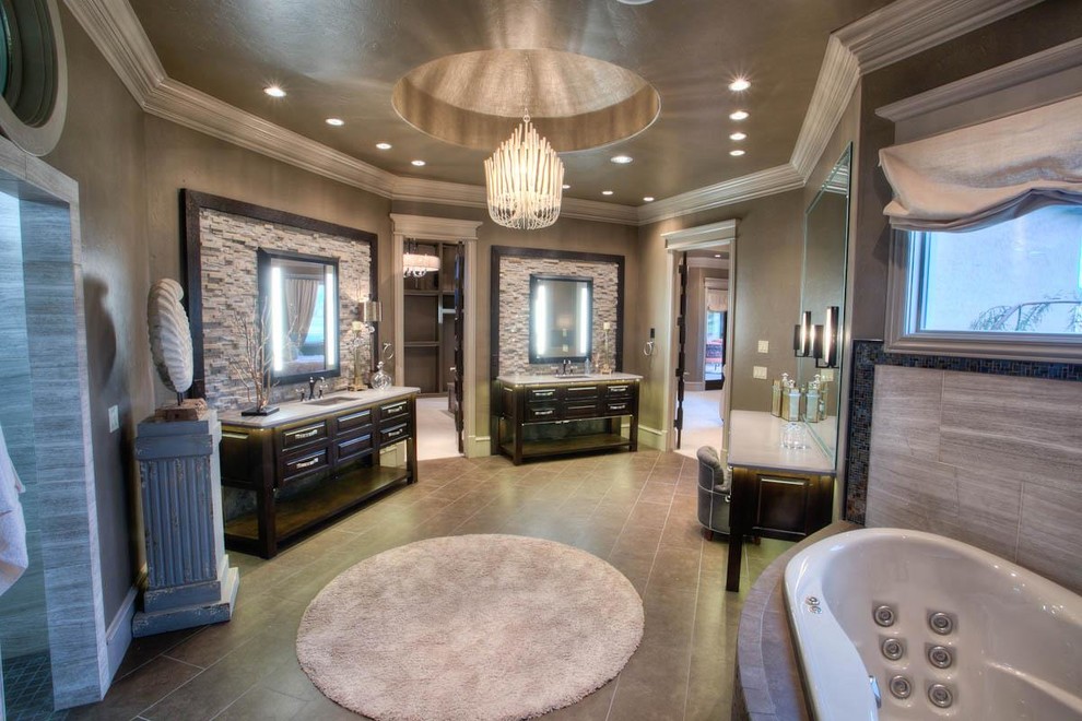 Photo of a classic bathroom in Oklahoma City with raised-panel cabinets, dark wood cabinets, a built-in bath, beige tiles and stone tiles.