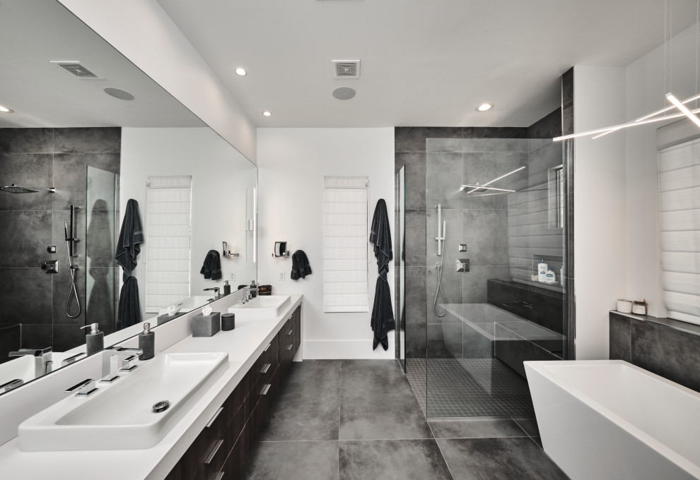 Mid-sized minimalist master gray tile and ceramic tile porcelain tile, gray floor and single-sink bathroom photo in Phoenix with flat-panel cabinets, brown cabinets, white walls, an undermount sink, quartz countertops, white countertops and a floating vanity