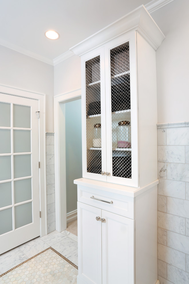 Large traditional ensuite bathroom in Chicago with freestanding cabinets, white cabinets, white tiles, stone tiles and grey walls.