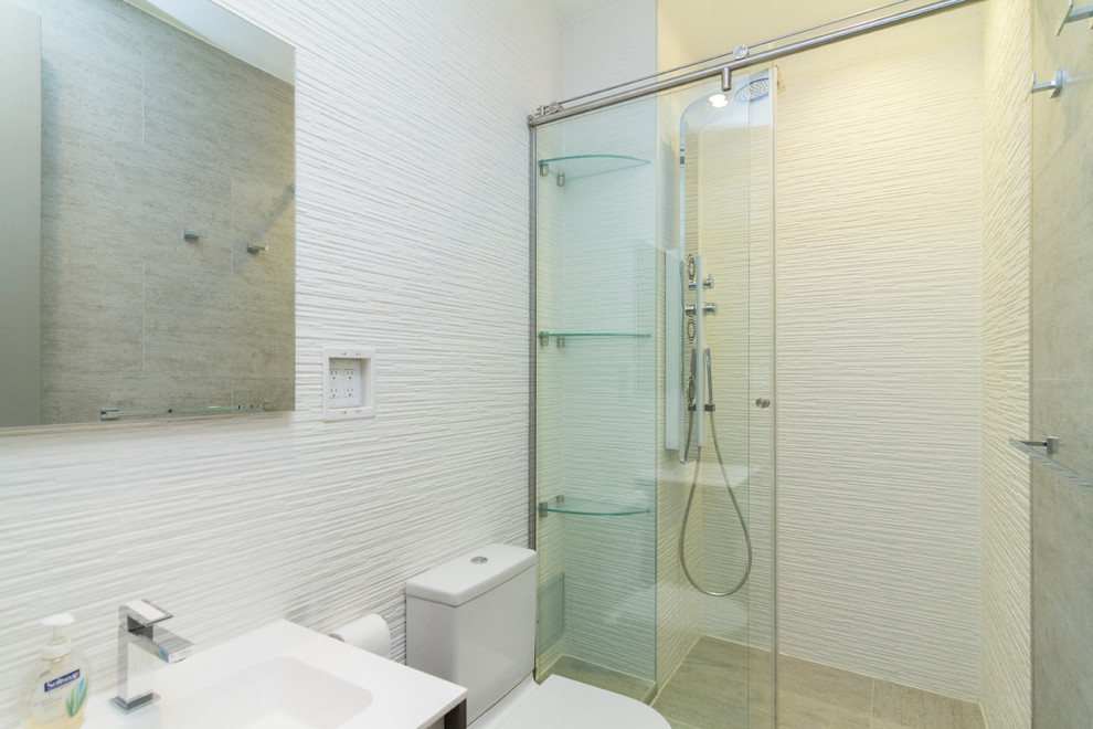 Design ideas for a medium sized traditional shower room bathroom in New York with a walk-in shower, a two-piece toilet, white tiles, open cabinets, white walls, ceramic flooring, a pedestal sink, beige floors and a hinged door.