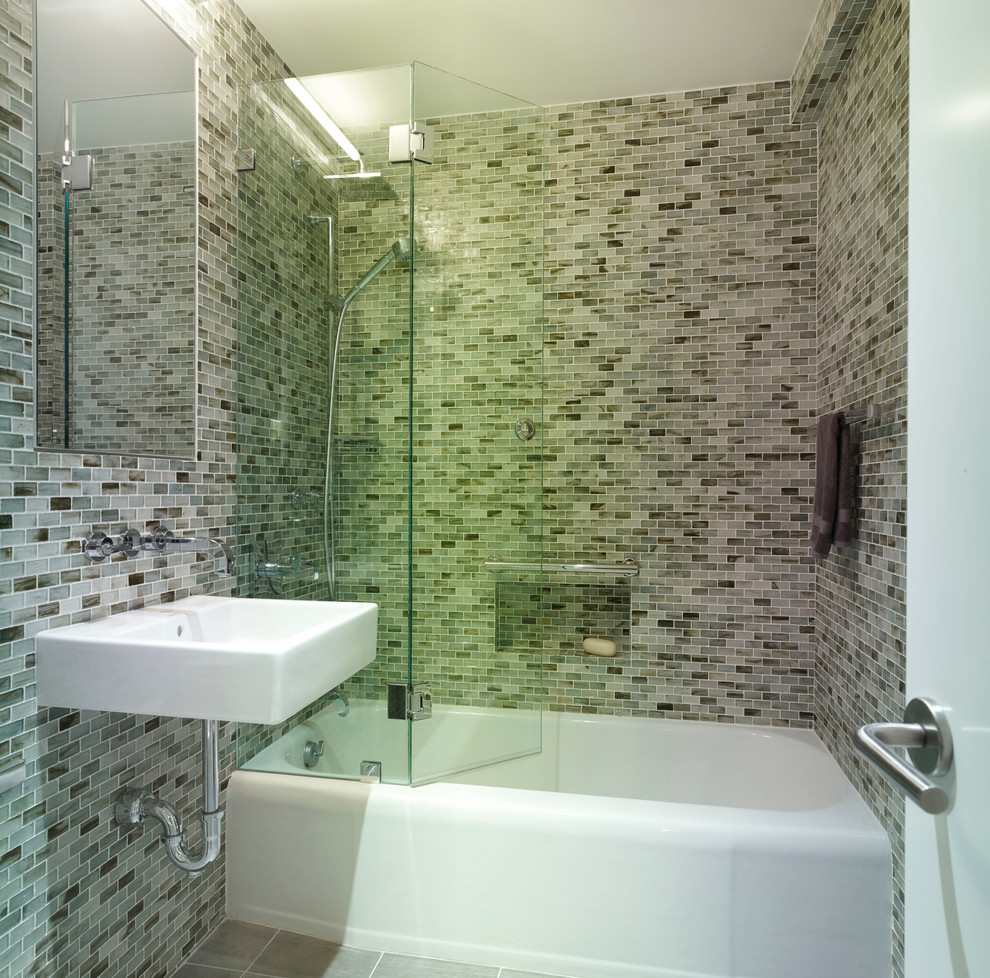 Example of a mid-sized minimalist green tile and glass tile bathroom design in New York with a wall-mount sink