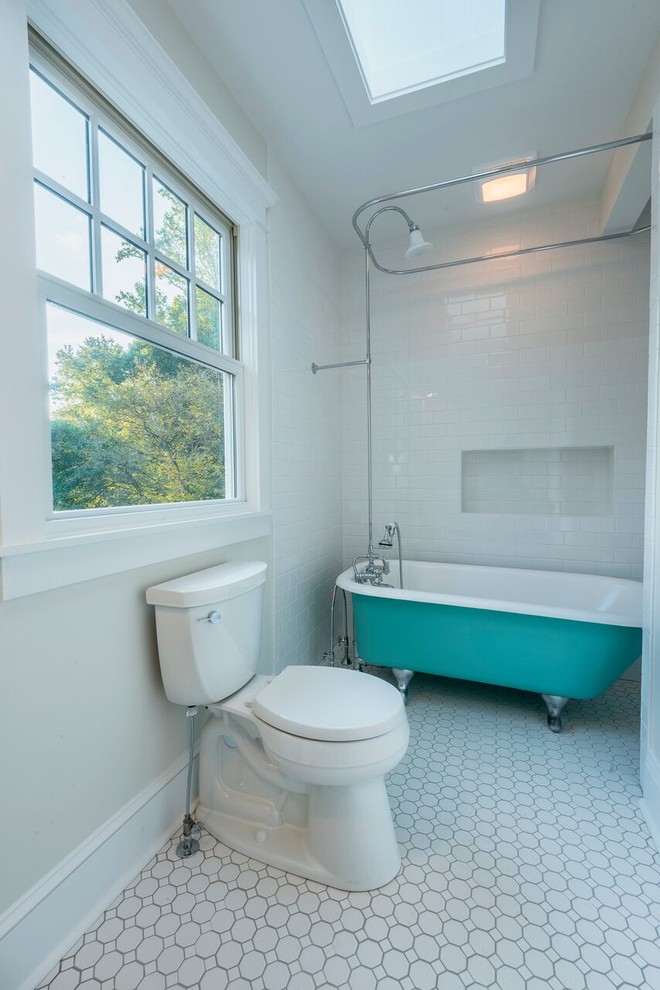 This is an example of a medium sized farmhouse family bathroom in Other with a claw-foot bath, a shower/bath combination, white walls, a shower curtain, a two-piece toilet, white tiles, metro tiles, mosaic tile flooring, a pedestal sink and white floors.