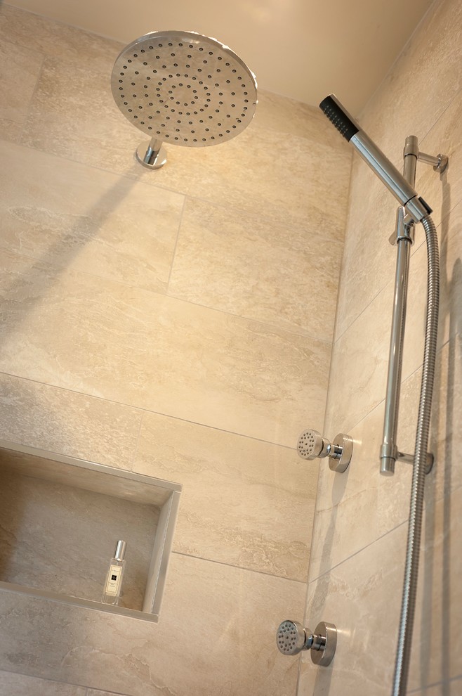 Example of a large cottage master gray tile and limestone tile medium tone wood floor and brown floor doorless shower design in Sussex with flat-panel cabinets, white cabinets, a one-piece toilet, white walls, a console sink, quartz countertops and a hinged shower door