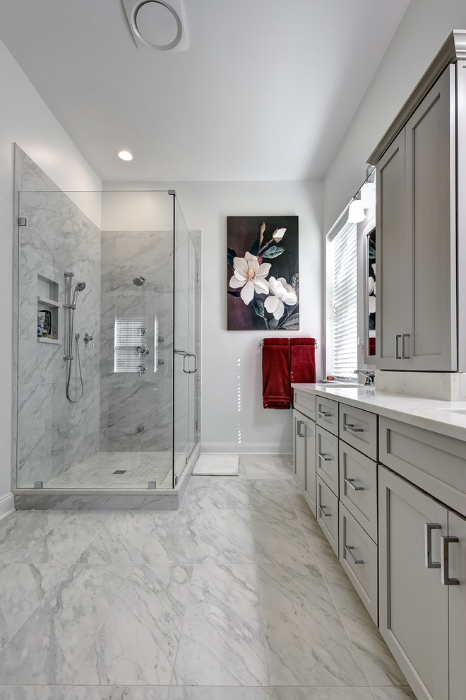 Mid-sized trendy master gray tile and porcelain tile porcelain tile corner shower photo in Charleston with shaker cabinets, gray cabinets, a two-piece toilet, gray walls, an undermount sink and quartz countertops