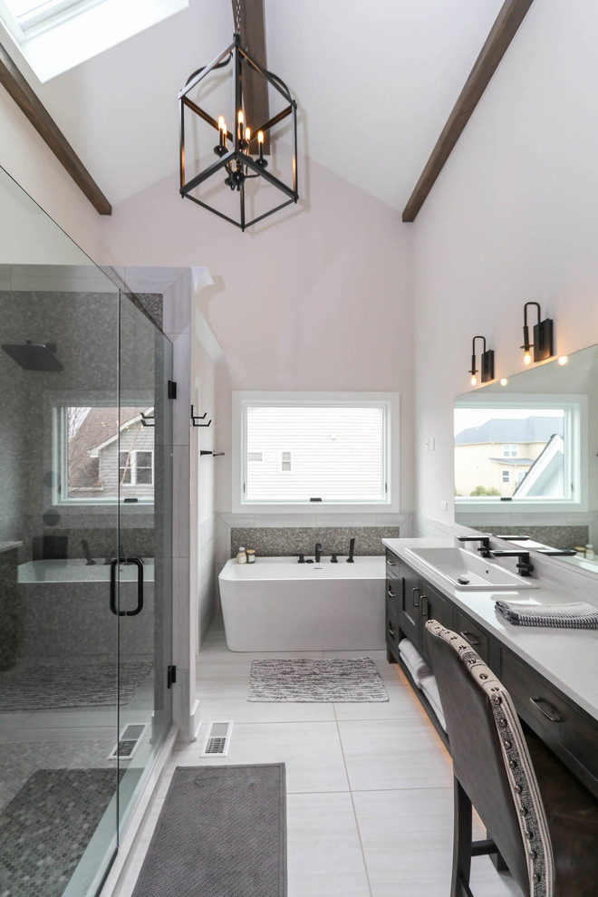 Example of a large country master gray tile and ceramic tile ceramic tile and white floor bathroom design in Chicago with shaker cabinets, distressed cabinets, a one-piece toilet, white walls, a drop-in sink, quartz countertops and white countertops