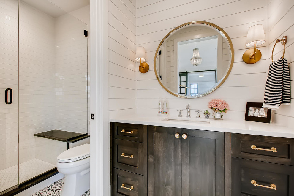 Cottage white tile and subway tile multicolored floor alcove shower photo in Denver with shaker cabinets, dark wood cabinets, white walls, an undermount sink, a hinged shower door and white countertops