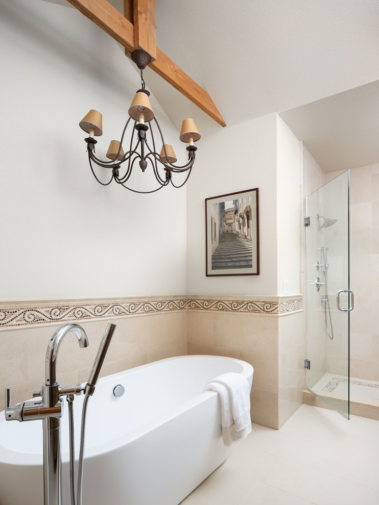 Small transitional 3/4 multicolored tile and stone tile ceramic tile and white floor freestanding bathtub photo in Other with furniture-like cabinets, light wood cabinets, a two-piece toilet, white walls, an undermount sink, granite countertops, a hinged shower door and white countertops