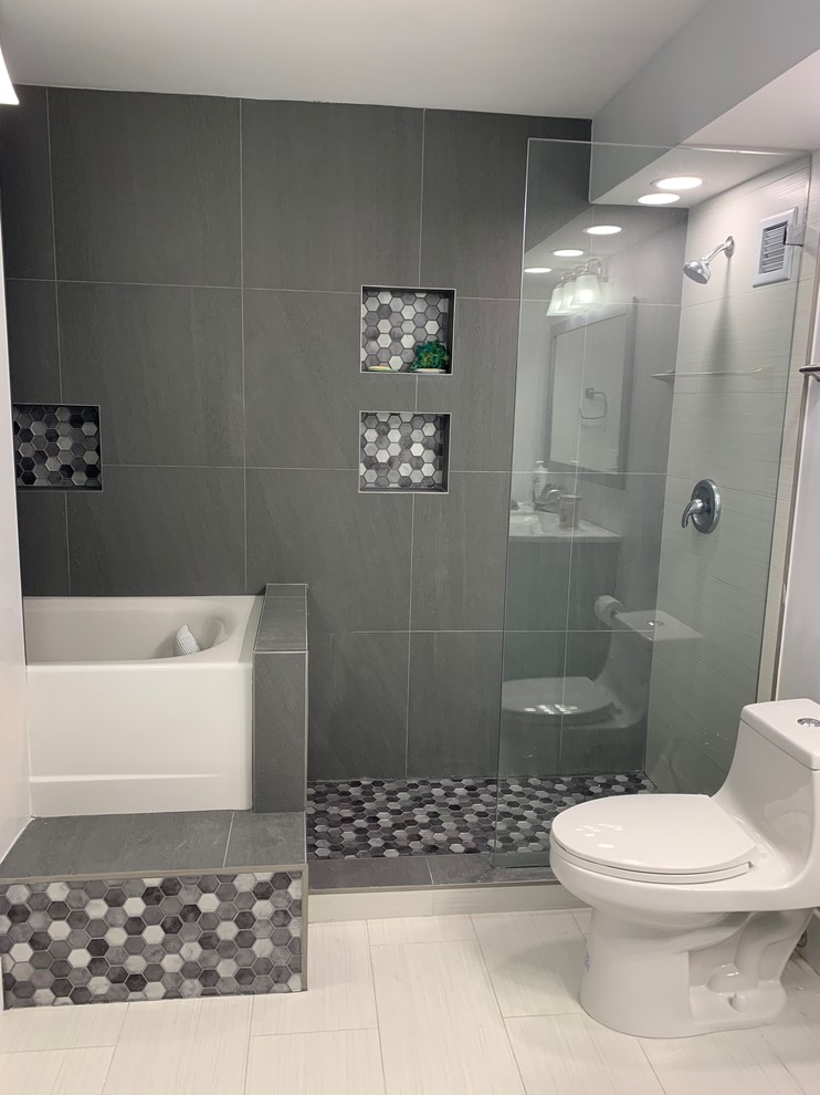 Mid-sized minimalist master porcelain tile and white floor bathroom photo in Miami with furniture-like cabinets, blue cabinets, a one-piece toilet, gray walls, an undermount sink, marble countertops and multicolored countertops