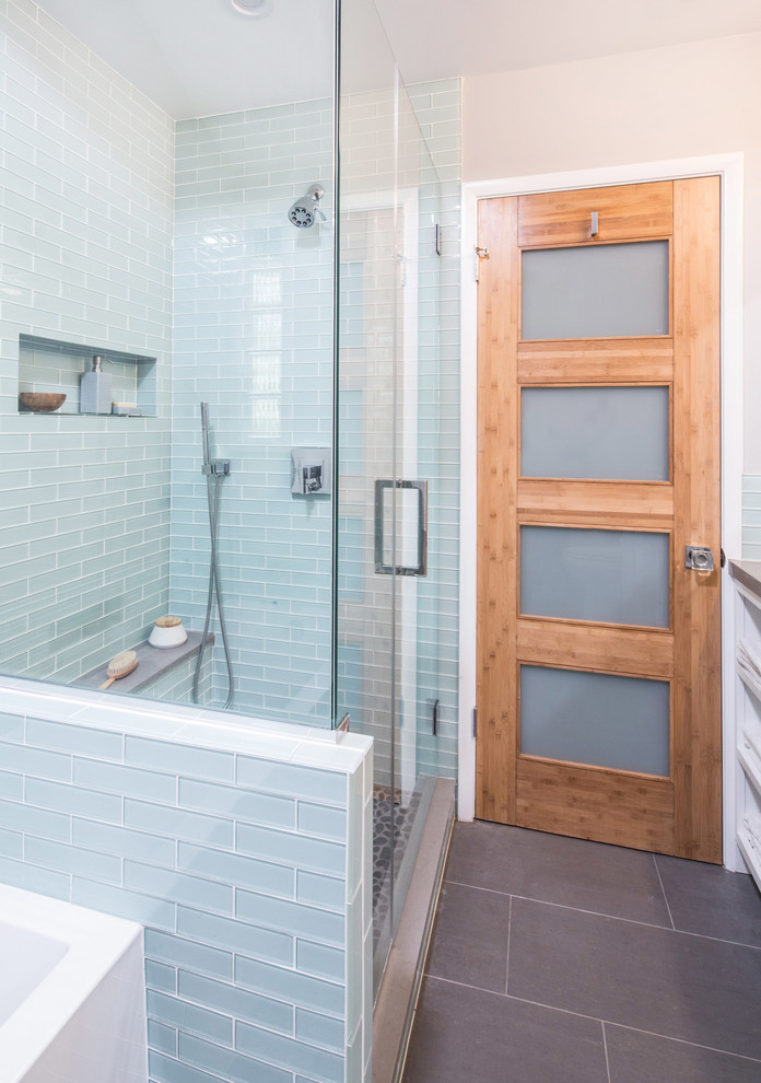 Bathroom - mid-sized modern master gray tile and porcelain tile porcelain tile and brown floor bathroom idea in Los Angeles with an undermount sink, shaker cabinets, white cabinets, quartz countertops, a one-piece toilet, gray walls and a hinged shower door