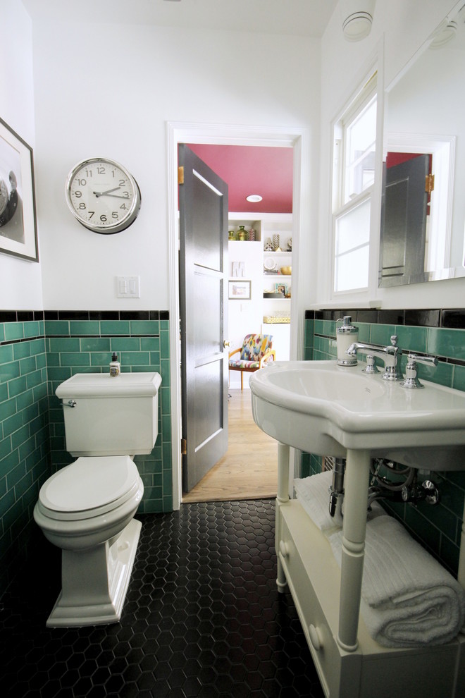 This is an example of a small traditional shower room bathroom in Los Angeles with a pedestal sink, white cabinets, an alcove shower, a two-piece toilet, green tiles, metro tiles, white walls and porcelain flooring.