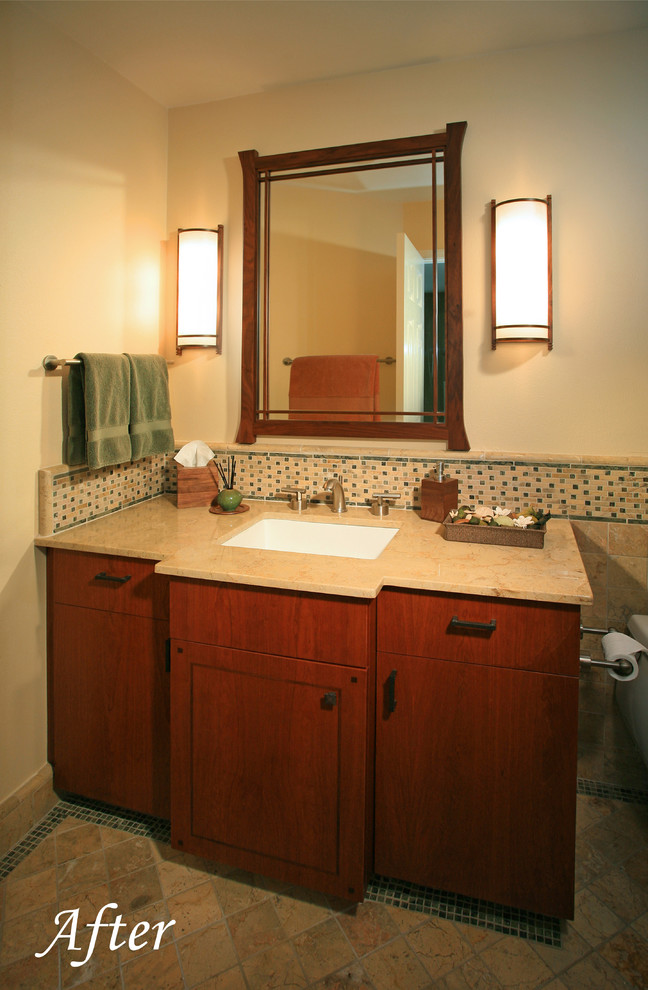 Mid-sized arts and crafts multicolored tile and stone tile marble floor bathroom photo in Los Angeles with an undermount sink, flat-panel cabinets, medium tone wood cabinets, marble countertops, a one-piece toilet and beige walls