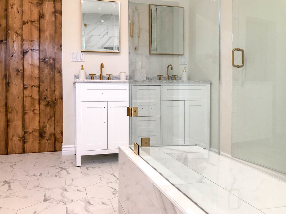 Photo of a medium sized classic ensuite bathroom in Los Angeles with white cabinets, a corner shower, a two-piece toilet, ceramic tiles, ceramic flooring, a built-in sink, engineered stone worktops, a hinged door, grey worktops, white tiles, beige walls, grey floors, shaker cabinets, a shower bench, double sinks and a freestanding vanity unit.