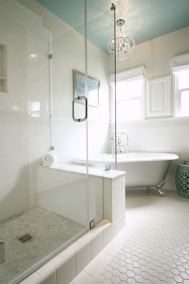 Medium sized classic ensuite bathroom in Los Angeles with a submerged sink, shaker cabinets, white cabinets, marble worktops, a claw-foot bath, a one-piece toilet, white tiles, metro tiles, grey walls and porcelain flooring.