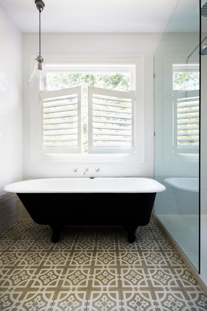 Design ideas for a traditional bathroom in Melbourne with a freestanding bath and white walls.