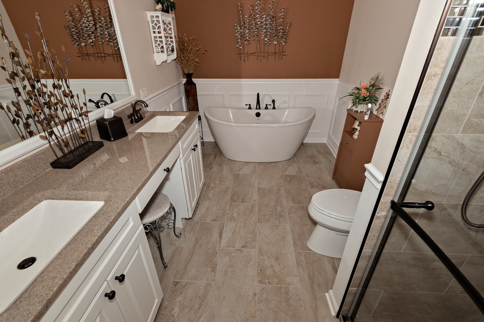Bathroom - large transitional master beige tile and porcelain tile porcelain tile and beige floor bathroom idea in Chicago with raised-panel cabinets, white cabinets, a two-piece toilet, beige walls, an integrated sink, onyx countertops, a hinged shower door and beige countertops