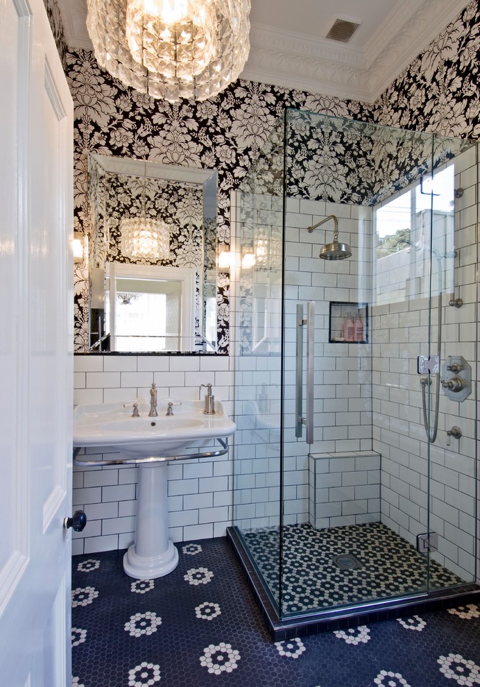 Inspiration for a small timeless master white tile and subway tile ceramic tile and black floor corner shower remodel in Wellington with a pedestal sink and a hinged shower door