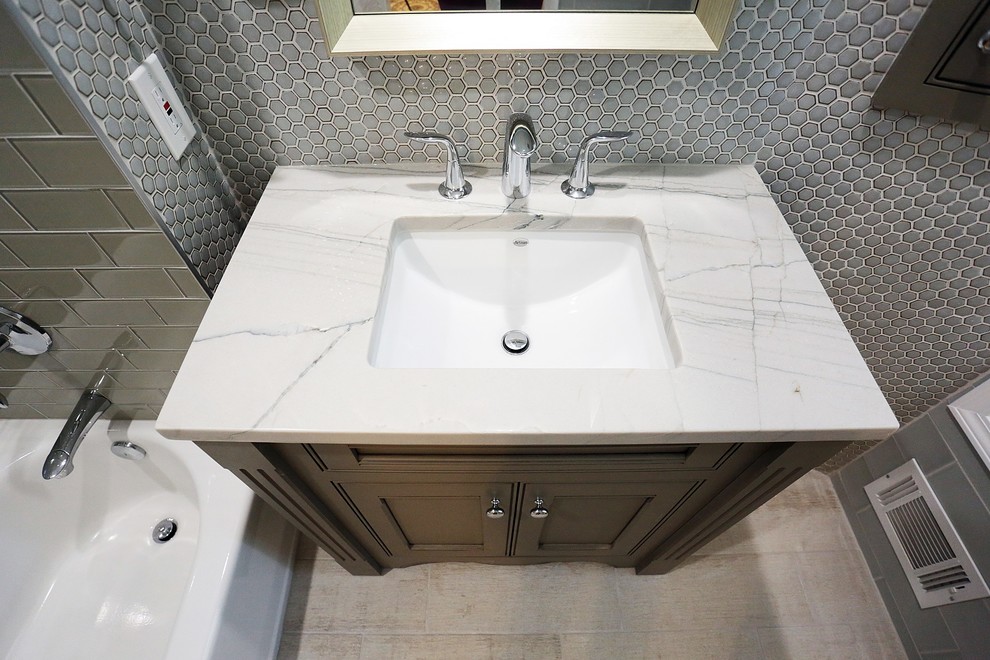 This is an example of a small contemporary bathroom in Atlanta with mosaic tiles and quartz worktops.