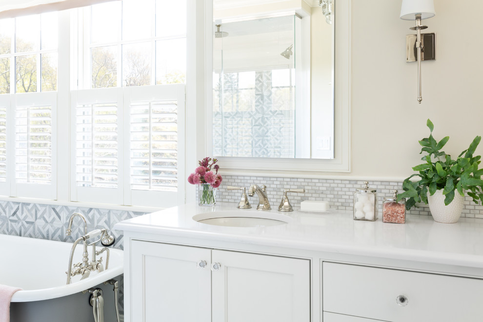 Bathroom - coastal master white tile bathroom idea in Boston with recessed-panel cabinets, white cabinets, a drop-in sink, a hinged shower door and white countertops