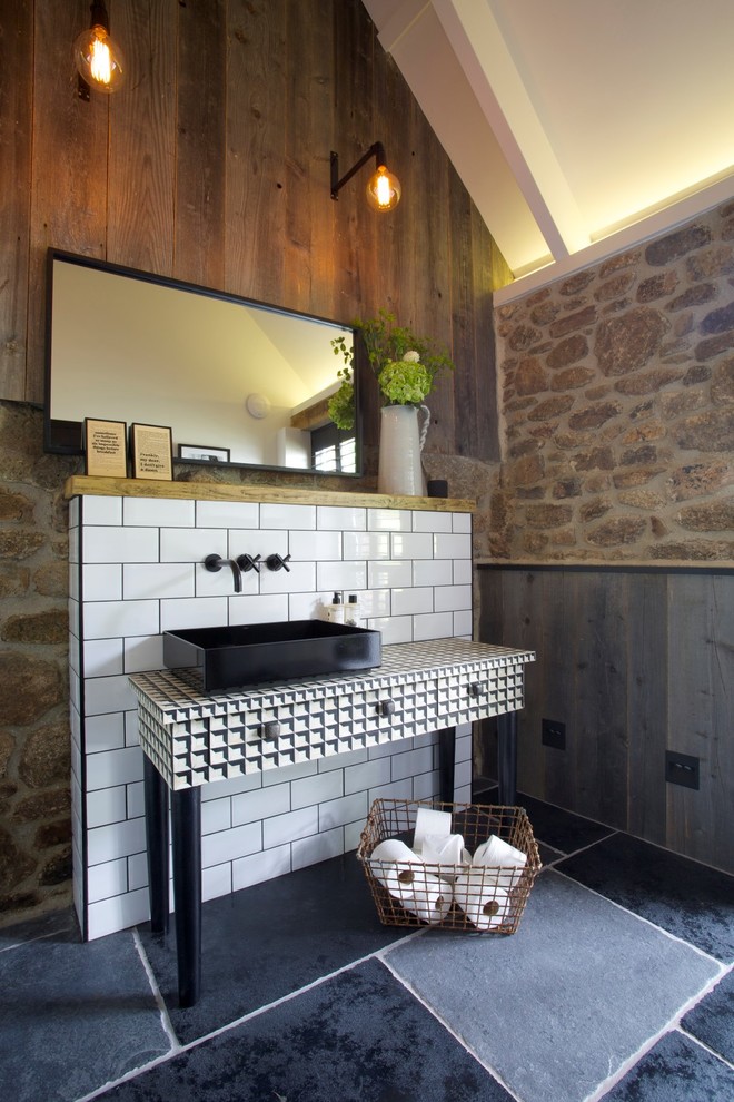 Eclectic bathroom in Devon with feature lighting.