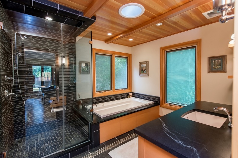 Large trendy master black tile and ceramic tile ceramic tile bathroom photo in New York with an undermount sink, flat-panel cabinets, light wood cabinets, granite countertops, a one-piece toilet and white walls