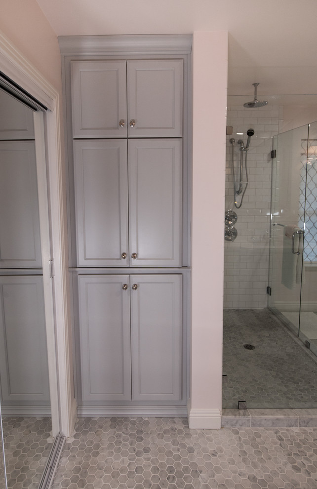Inspiration for a medium sized traditional ensuite bathroom in Other with recessed-panel cabinets, grey cabinets, a two-piece toilet, white tiles, metro tiles, pink walls, marble flooring, a submerged sink, engineered stone worktops, grey floors, a hinged door and white worktops.