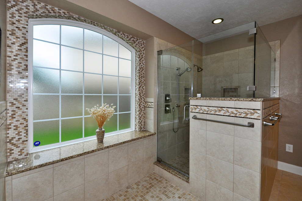 На фото: ванная комната в классическом стиле с врезной раковиной, фасадами с выступающей филенкой, темными деревянными фасадами, угловым душем, бежевой плиткой, бежевыми стенами и душевой кабиной