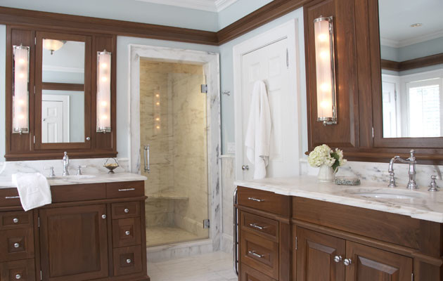 Inspiration for a traditional bathroom in New York with dark wood cabinets and blue walls.