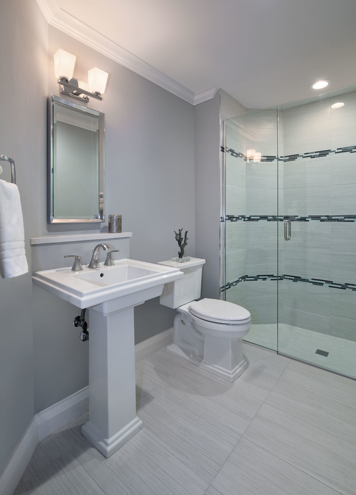 Photo of a medium sized contemporary family bathroom in Miami with a built-in shower, a two-piece toilet, grey walls, porcelain flooring and a pedestal sink.